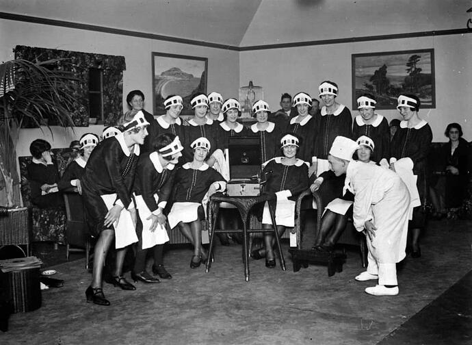 junior-chef-explaining-the-Black-Bottom-dance-steps-to-the-waitresses-called-nippies-in-the-rest-room-of-the-Lyons-Corner-House.December-1927-1280x937-2849355019