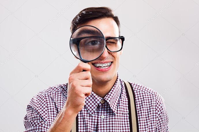 depositphotos_85510164-stock-photo-nerd-man-with-magnifying-glass-1470539174