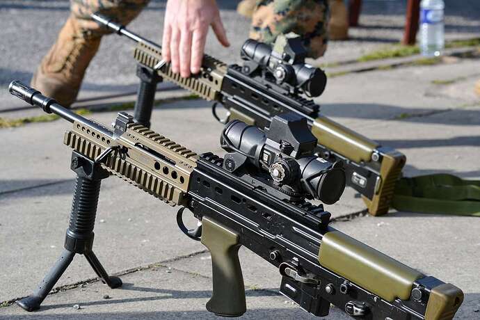 two-sa80-a2-l85-assault-rifles-sit-on-the-ground-at-51668c-1024