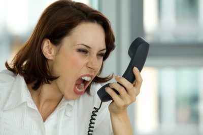 Angry-Lady-Screaming-into-Phone-1669365-1295602024